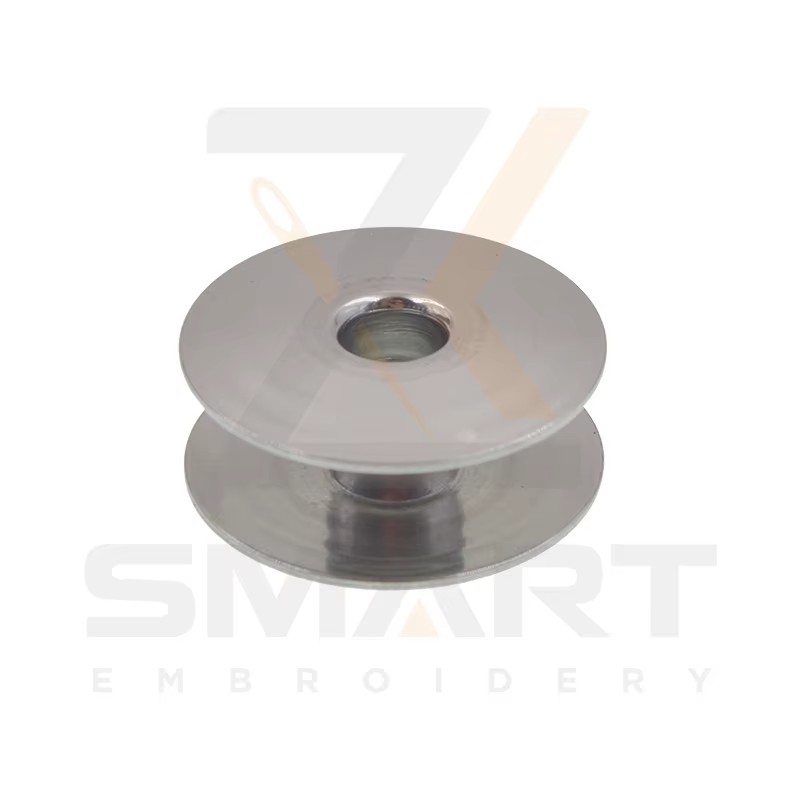 100 PC Jumbo M izmērs 2.0 nerūsējošā tērauda materiāla pārseguma mašīna Bobbins Tajima SWF ķīniešu pārseguma mašīnas daļas R0620-SS